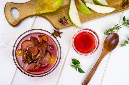 Jam from pears and apples in sweet syrup. Studio Photo