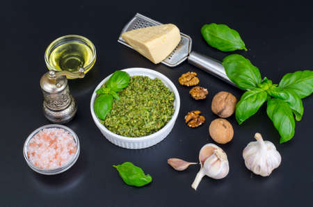 Ingredients for making pesto with walnut on black backgroundの写真素材