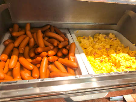 Delicious breakfast: cooked omelet and boiled sausages. Studio Photoの写真素材