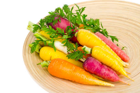 Fresh organic farm carrots of various types and colors. Studio Photoの写真素材