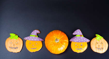 Halloween gingerbread cookies on black background. Studio Photo