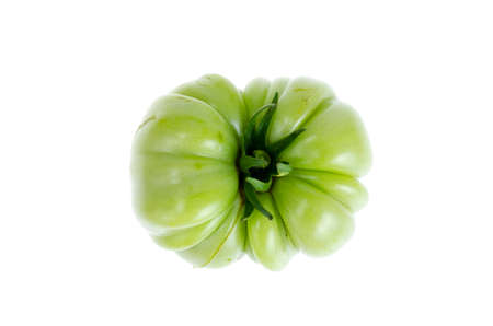 Green unripe tomato isolated on white background. Studio Photoの写真素材