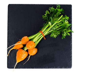 Organic farmer fresh carrots on black background. Studio Photoの写真素材