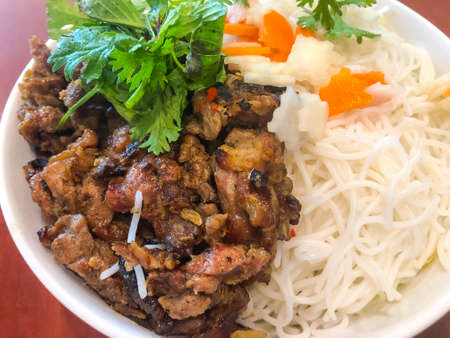 Delicious spicy Chinese food with pasta and meat. Studio Photo