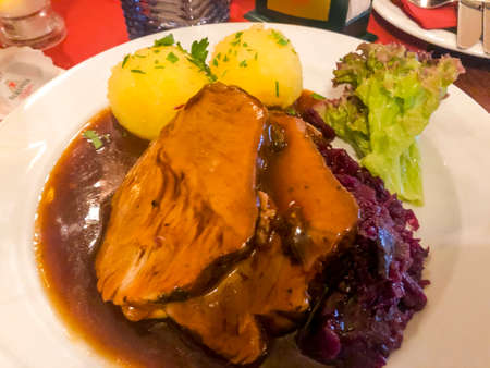 Tasty stewed meat, red cabbage and potato dumplings. Photo Studioの写真素材