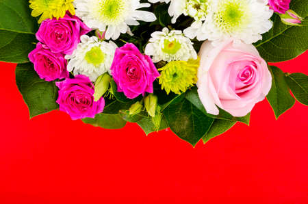 Floral arrangement on bright background with place for text. Studio Photo