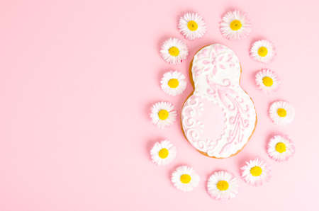 Figure eight homemade cakes and flowers on bright background. Studio Photoの写真素材