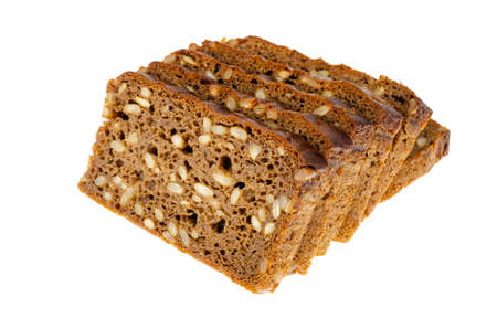 Slices of brown rye bread with sunflower seeds isolated on white background. Studio Photo