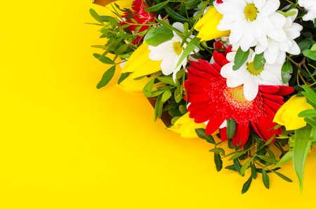 Delicious bouquet of flowers on yellow background. Studio Photoの写真素材