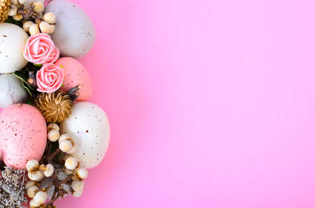 Easter wreath of colorful decorative eggs, flowers. Studio Photo