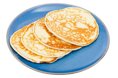 Delicious sweet thin pancakes on blue plate. Studio Photoの写真素材