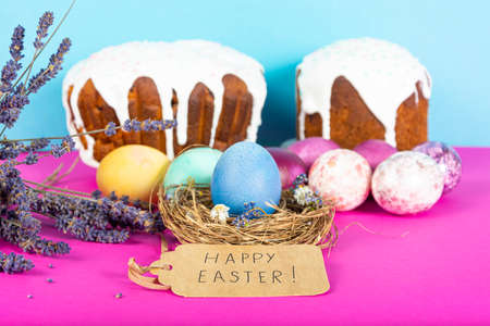 Colorful background with Easter eggs on pink and blue background. Happy Easter concept. Can be used...