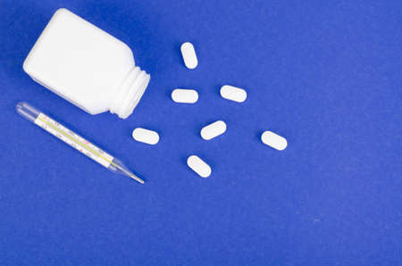 Disease and treatment. Medicine concept. Medication and packaging on bright background.