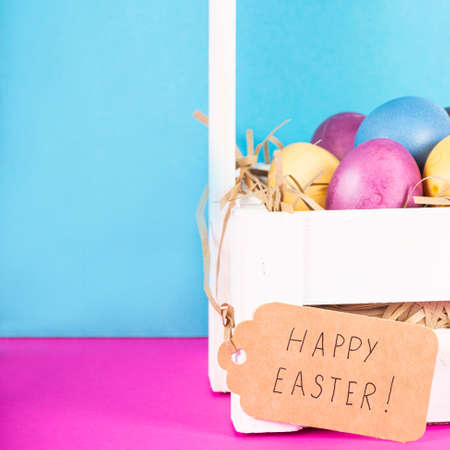 Colorful background with Easter eggs on pink and blue background. Happy Easter concept. Can be used...