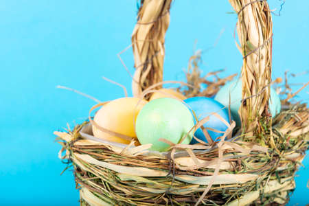 Colorful background with Easter eggs on blue background. Happy Easter concept. Can be used as...