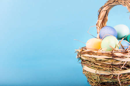 Colorful background with Easter eggs on blue background. Happy Easter concept. Can be used as...