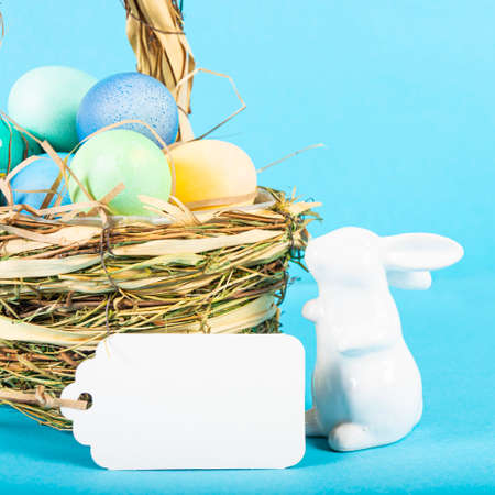 Colorful background with Easter eggs on blue background. Happy Easter concept. Can be used as poster, background, holiday card. Flat lay, top view, copy space.の写真素材
