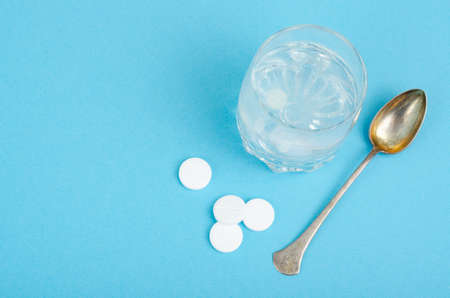 White round tablets, soluble in glass of water.の写真素材