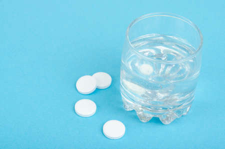 White round tablets, soluble in glass of water.の写真素材
