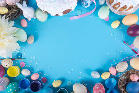Colorful background with Easter eggs on blue background. Happy Easter concept. Can be used as...