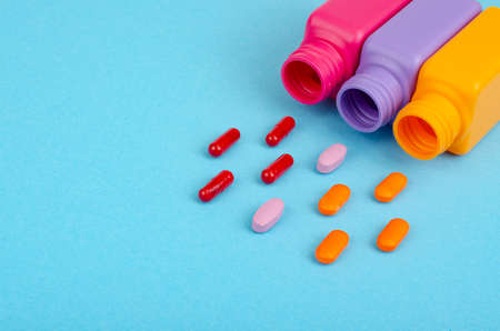 Disease and treatment. Medicine concept. Medication and packaging on bright background.