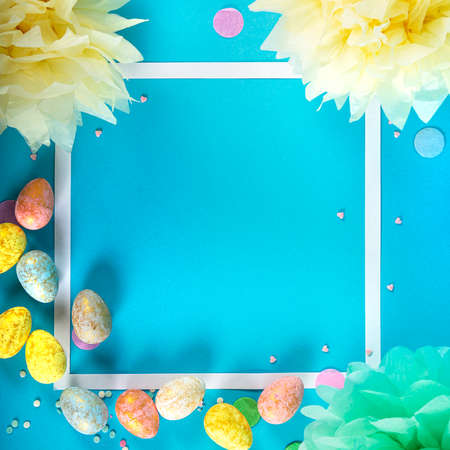 Party Holiday Background with ribbon, stars, birthday candles and confetti on blue background.の写真素材