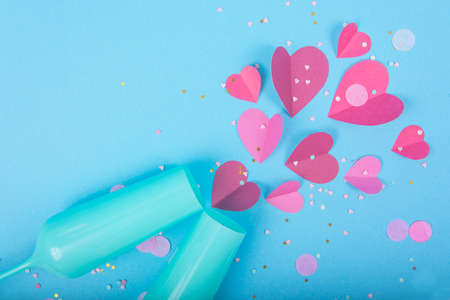 Abstract Background with Paper Hearts, blue champagne glass for Valentine`s Day. Blue Love and Feeling Background for poster, banner, post, card. Top viewの写真素材