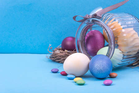 Colorful background with Easter eggs on blue background. Happy Easter concept. Can be used as...