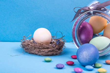 Colorful background with Easter eggs on blue background. Happy Easter concept. Can be used as...