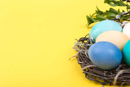 Colorful background with Easter eggs on yellow background. Happy Easter concept. Can be used as...