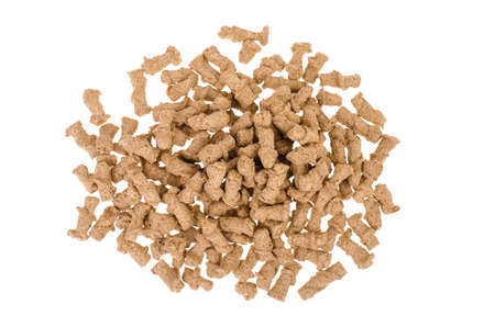 Healthy food products. Extruded rye bran on white background. Studio Photo