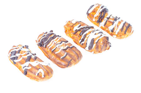 Iced custard cakes with cream, confectionery. Photo