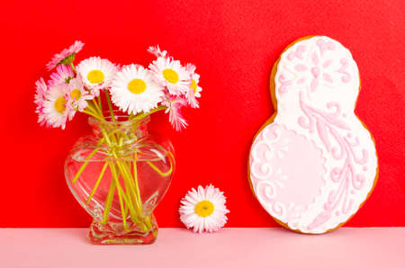 Figure eight homemade cakes and flowers on bright background. Studio Photoの写真素材