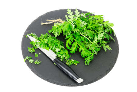 Baunch of edible herbs on black plate. Studio Photoの写真素材