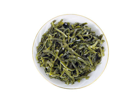 Seaweed - food product from brown seaweed of kelp. Studio Photo
