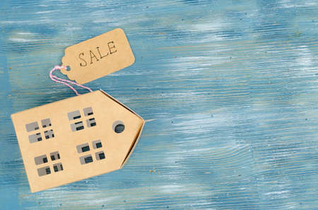 Real estate sale concept, paper model of residential building. Studio Photoの写真素材