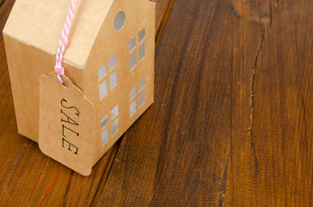 Real estate sale concept, paper model of residential building. Studio Photoの写真素材