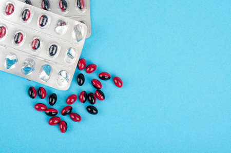 Bicolor medical pills on bright background. Studio Photoの写真素材