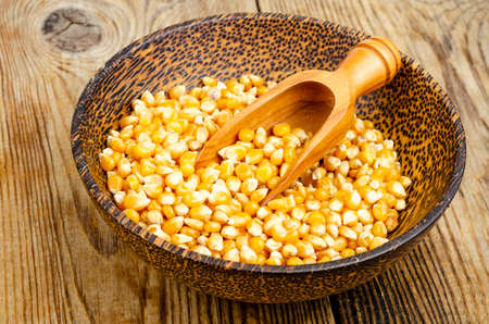 Dry corn grains in bowl for making popcorn. Studio Photoの写真素材