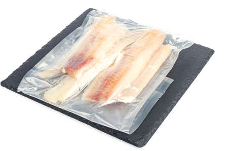 Packaging of frozen fillets of white fish, pollock. Studio Photo