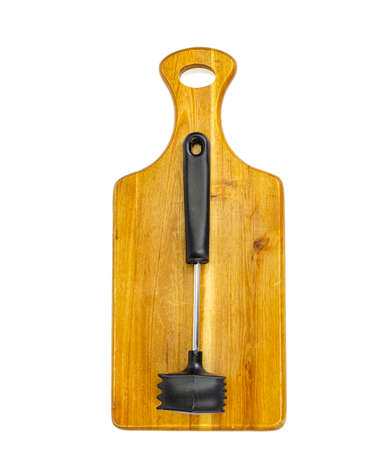 Kitchen hammer for meat on wooden cutting board. Studio Photoの写真素材