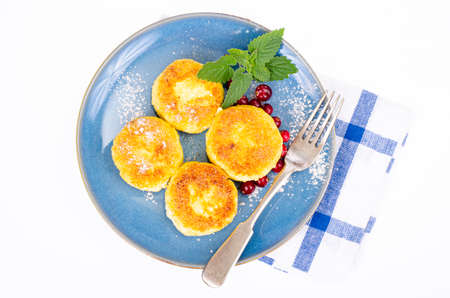 Sweet cottage cheese pancakes on plate, dairy products. Studio Photo