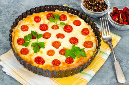 Homemade baking. Cherry tomato snack pie. Studio Photo