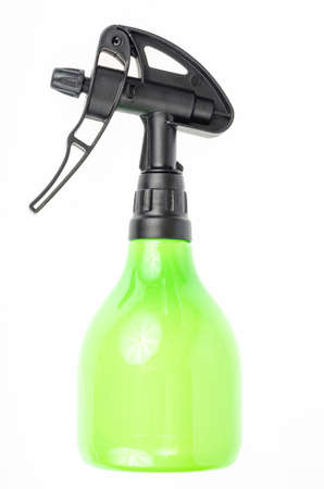 Green garden hand plant sprayer isolated on white background. Disease and pest control. Studio Photo.の写真素材