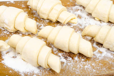 Puff pastry, frozen croissants on board. Studio Photo.の写真素材