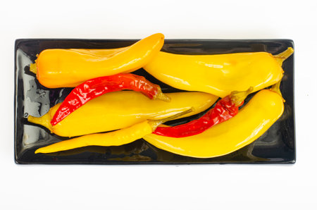 Plate with pickled hot paprika. Studio Photo.の写真素材
