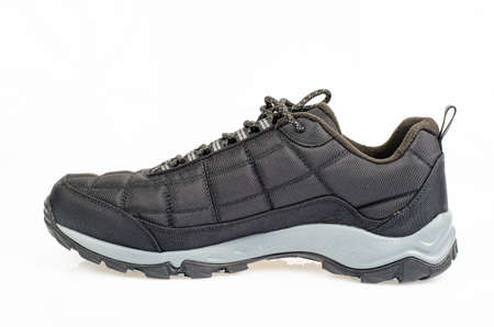 Black sports insulated shoes on white background. Studio Photo.の写真素材