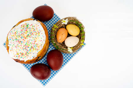 Preparation for celebration of Easter. Homemade cake and red colored eggs. photoの写真素材