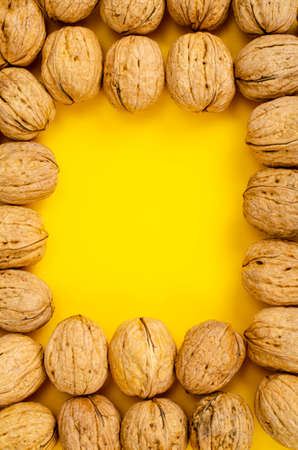 Unpeeled walnuts, background, texture. photoの写真素材