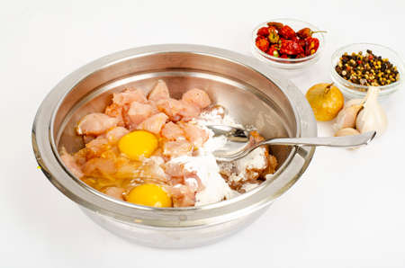 Pieces of chicken fillet, raw eggs, spices for cooking. photoの写真素材